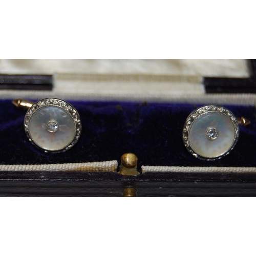 69 - Pair of gold dress cufflinks, with pearl and collet-set diamonds, '14'.