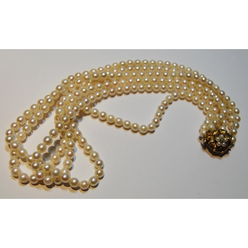 71 - Cultured pearl three-row necklet, on 9ct gold snap.