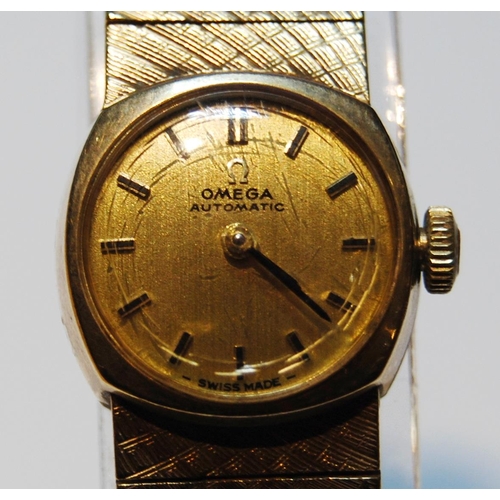 132 - Omega Automatic ladies 9ct gold bracelet watch, 1957, 35.6g gross.