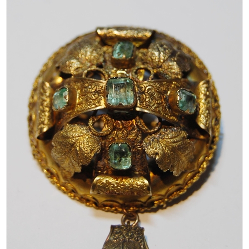 74 - Victorian gold circular brooch pendant with five foiled emeralds, probably 15ct, 10g.