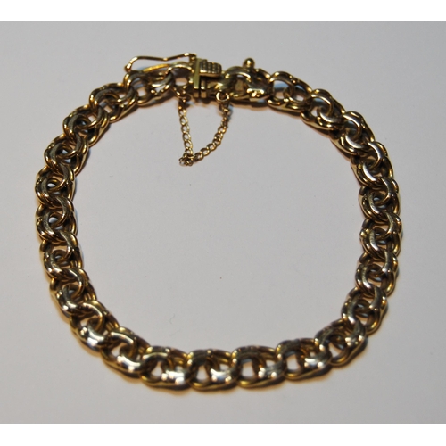 78 - Gold bracelet of filed double curb pattern, '18kt', 23.7g.