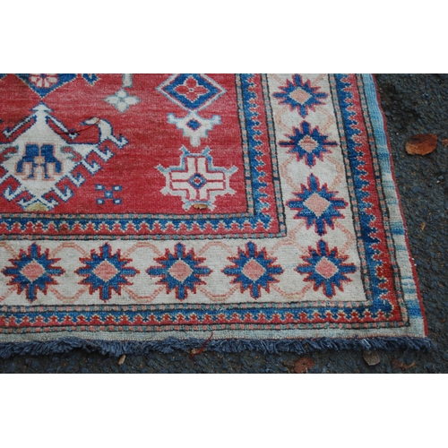 324 - Turkish Milas hand-knotted rug with central geometric medallion flanked by smaller geometric motifs ... 