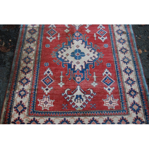 324 - Turkish Milas hand-knotted rug with central geometric medallion flanked by smaller geometric motifs ... 