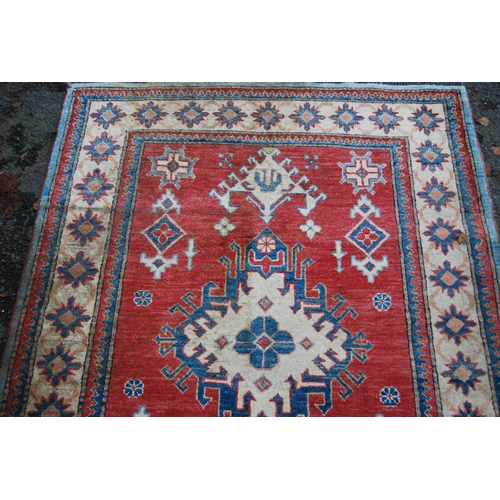 324 - Turkish Milas hand-knotted rug with central geometric medallion flanked by smaller geometric motifs ... 