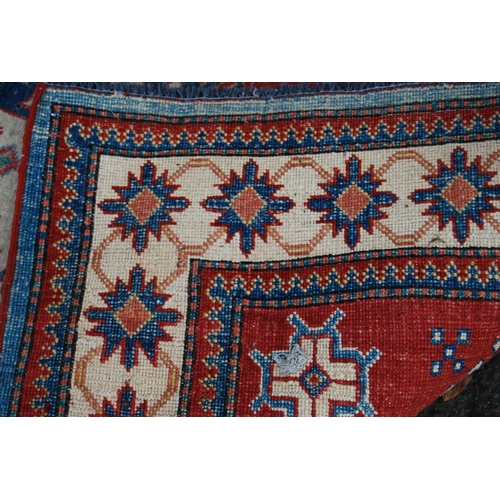 324 - Turkish Milas hand-knotted rug with central geometric medallion flanked by smaller geometric motifs ... 