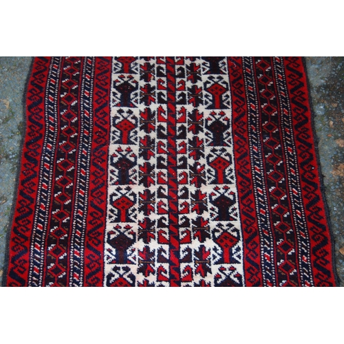 326 - Afghan Belouch hand-knotted rug with all-over geometric guls and motifs on red, blue and cream groun... 