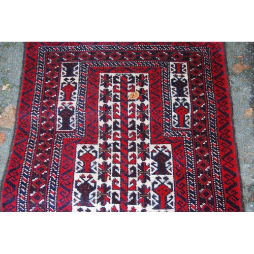 326 - Afghan Belouch hand-knotted rug with all-over geometric guls and motifs on red, blue and cream groun... 