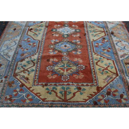 320 - Turkish Milas hand-knotted carpet with five geometric guls to the centre flanked by further geometri... 