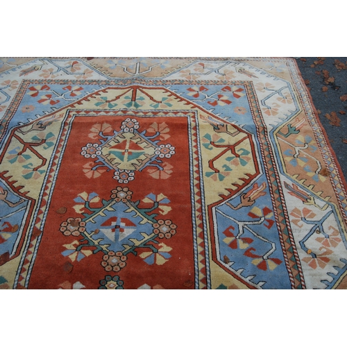 320 - Turkish Milas hand-knotted carpet with five geometric guls to the centre flanked by further geometri... 