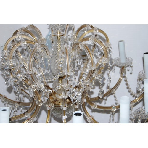 368 - Venetian-style glass chandelier with twelve scroll branches, decorated with pans, garlands and drops... 