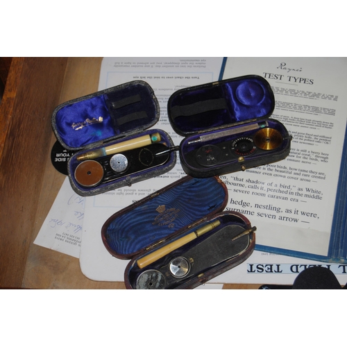 375 - Vintage oak optician's cabinet with glazed viewing top enclosing lenses in fitted compartments above... 