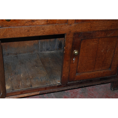 378 - 18th century Welsh oak cheese cupboard, the two panelled doors with pierced panels to the centre enc... 