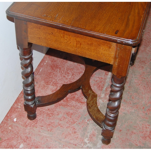 383 - Georgian oak side table with single drawer, on barley and bobbin column supports united by X-form un... 