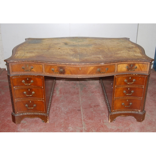 386 - Reproduction mahogany serpentine partner's desk with large drawer to both ends flanked by smaller dr... 