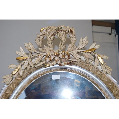 399 - French-style painted wood and gesso oval wall mirror with applied leaf garland surmounts, all-over m... 