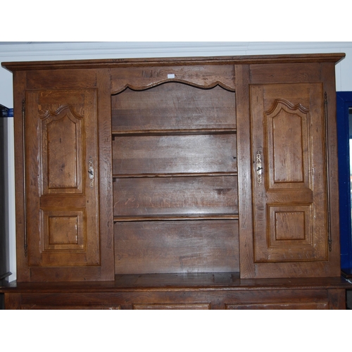 401 - Continental oak dresser, 20th century, the top section with open shelving flanked by panelled cupboa... 