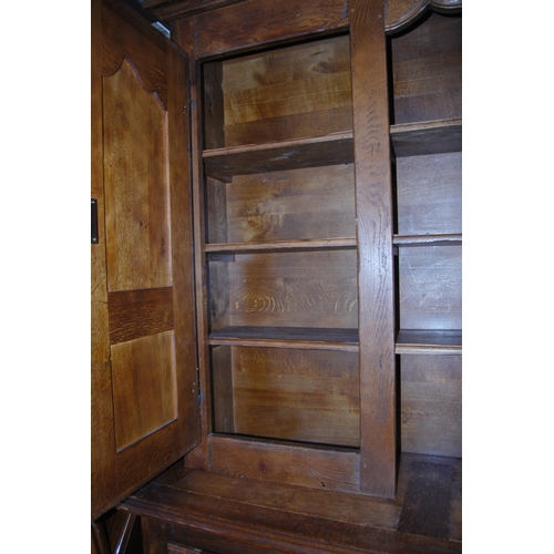 401 - Continental oak dresser, 20th century, the top section with open shelving flanked by panelled cupboa... 