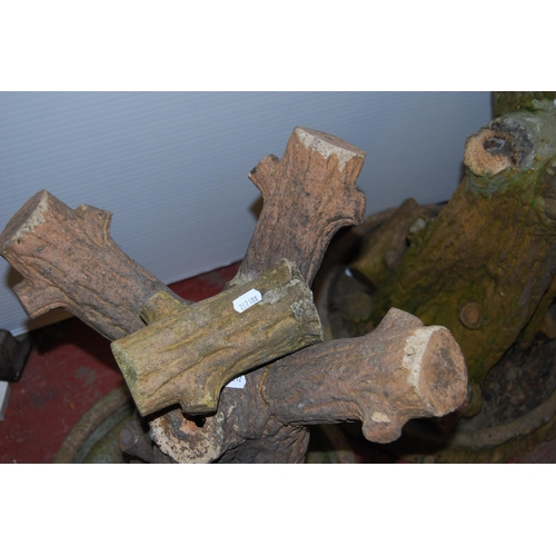 404 - Pair of garden terracotta pedestal tables of naturalistic form, the circular tops on tree-type stump... 