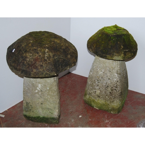 406 - Near-pair of antique garden stoneware staddle stones, each with a heavy mushroom-shaped top on colum... 