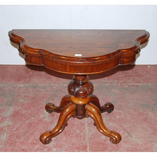 413 - Victorian rosewood tea table with shaped fold-over top, on turned baluster column, quadripartite sup... 