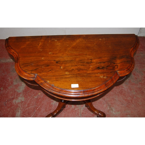 413 - Victorian rosewood tea table with shaped fold-over top, on turned baluster column, quadripartite sup... 