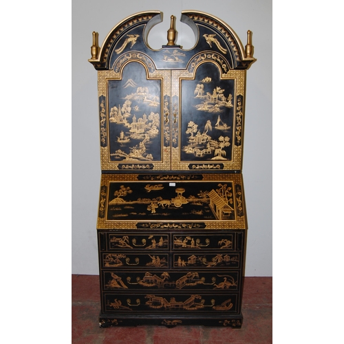 421 - Chinoiserie black lacquered bureau bookcase, the top section with two doors enclosing red lacquered ... 