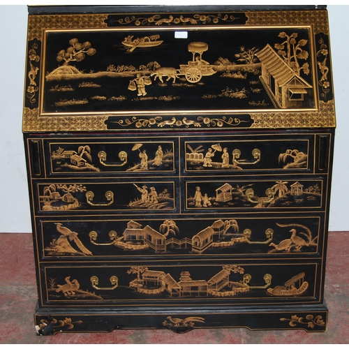 421 - Chinoiserie black lacquered bureau bookcase, the top section with two doors enclosing red lacquered ... 