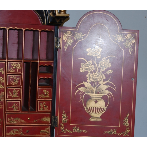 421 - Chinoiserie black lacquered bureau bookcase, the top section with two doors enclosing red lacquered ... 