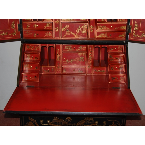 421 - Chinoiserie black lacquered bureau bookcase, the top section with two doors enclosing red lacquered ... 