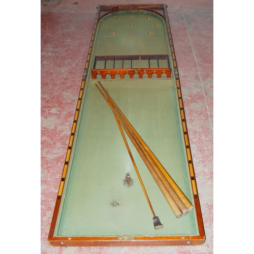 422 - Mahogany tabletop billiard table with cues and numbered rack.