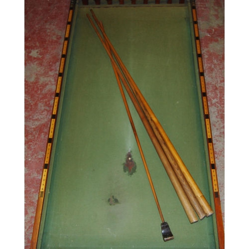 422 - Mahogany tabletop billiard table with cues and numbered rack.