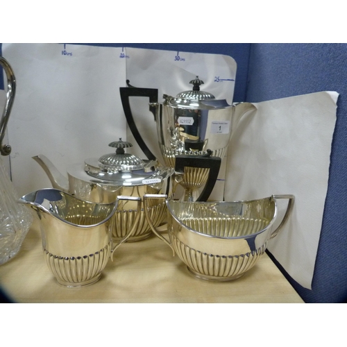 1 - Four-piece half reeded EP tea set and a claret jug with EP mount.