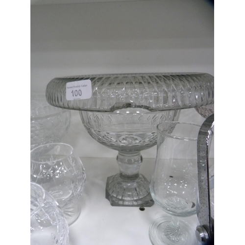 100 - Collection of glassware to include large comports, decanters, ice bucket etc (one shelf).