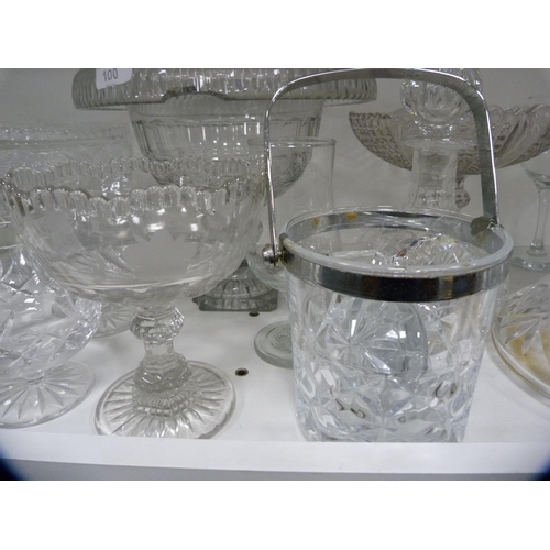 100 - Collection of glassware to include large comports, decanters, ice bucket etc (one shelf).