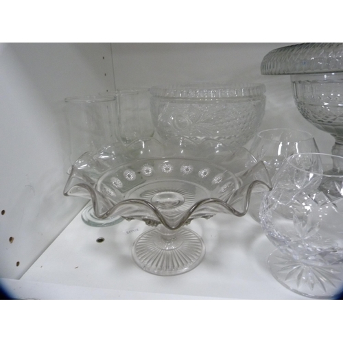 100 - Collection of glassware to include large comports, decanters, ice bucket etc (one shelf).