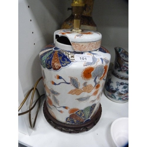 101 - Oriental-style table lamp, white pottery tureen, teawares etc (one shelf).