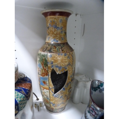 101 - Oriental-style table lamp, white pottery tureen, teawares etc (one shelf).