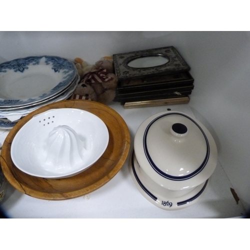 106 - Set of Salter scales, picnic basket, cookery books, blue and white plates, lamp etc (two shelves).