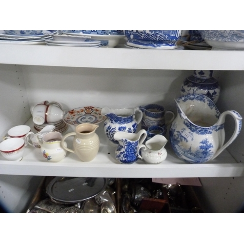 113 - Large blue and white ewer, similar vase, part tea set etc (one shelf).