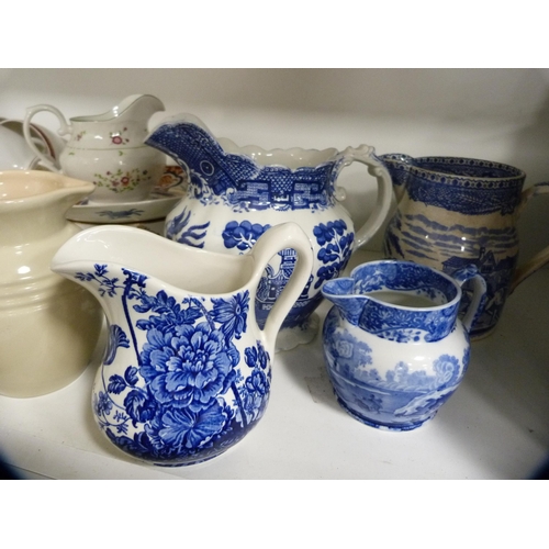 113 - Large blue and white ewer, similar vase, part tea set etc (one shelf).