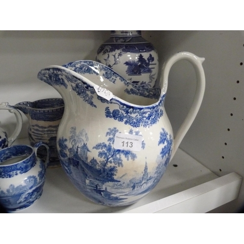 113 - Large blue and white ewer, similar vase, part tea set etc (one shelf).