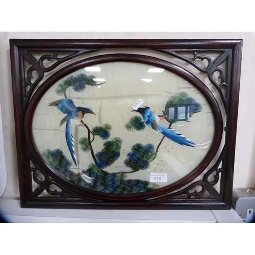 115 - Oriental framed embroidery depicting two exotic birds.