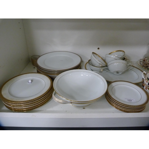 137 - Noritake part gilt dinner set and a Burnam part tea set (one shelf).