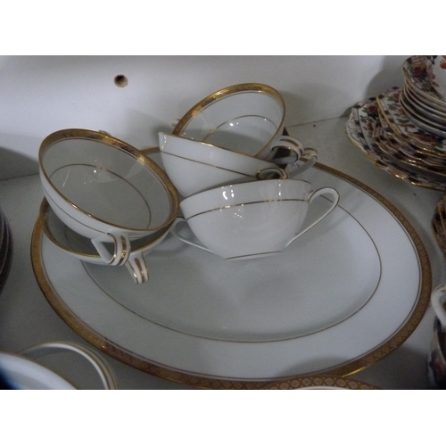 137 - Noritake part gilt dinner set and a Burnam part tea set (one shelf).