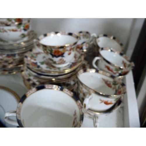 137 - Noritake part gilt dinner set and a Burnam part tea set (one shelf).