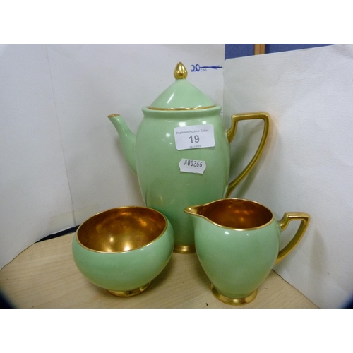 19 - Carlton Ware green and gilt part coffee set.