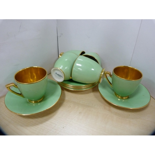 19 - Carlton Ware green and gilt part coffee set.