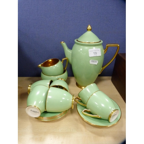 19 - Carlton Ware green and gilt part coffee set.