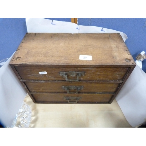 27 - Three-drawer table-top cabinet.