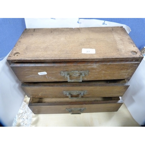 27 - Three-drawer table-top cabinet.